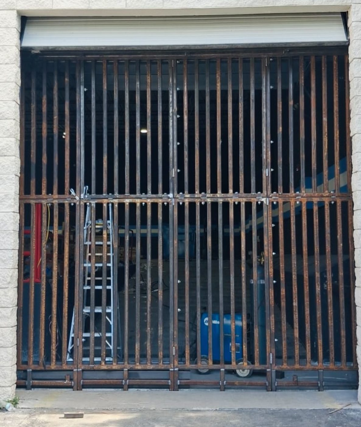 Welded steel security gate fabricated by Fine Edge Industries for a commercial property