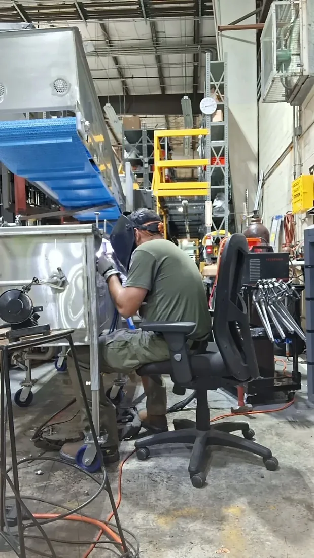Rafael of Fine Edge Industries welding on a Pompano Beach field job