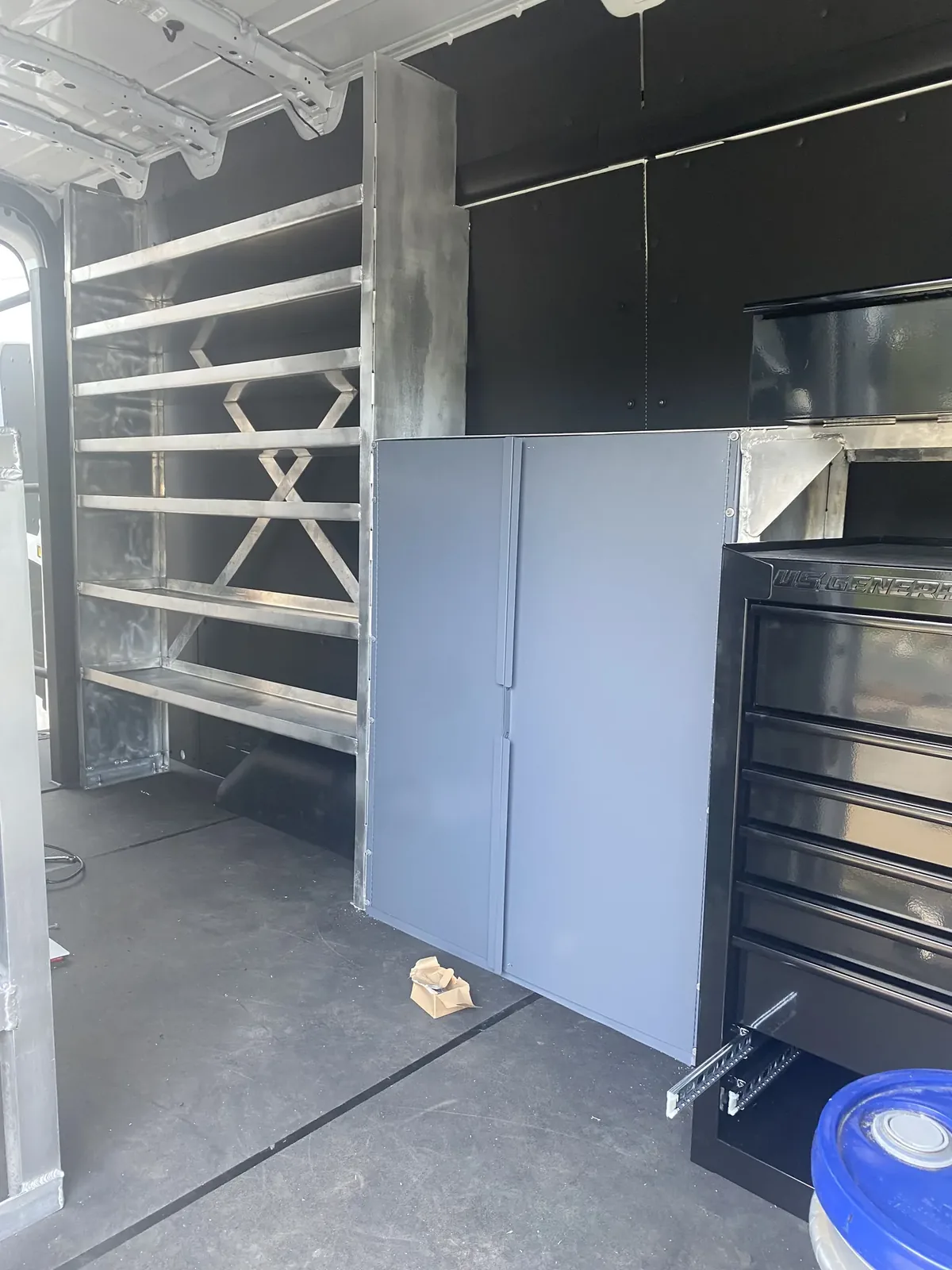 Fine Edge Industries custom van upfitting — interior shelving and storage
